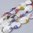 Witte Lampwork kralen met Millefiori, ovaal, 14x10mm. Verkocht per streng van ca. 38cm (26 kralen)