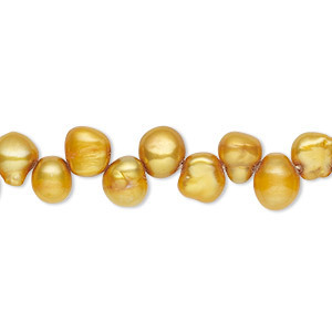 Zoetwaterparels, topgeboord, goud/amber. 6x5mm. Per snoer van 40cm